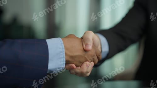 Preview: Business people shacking hands together showing successful contract agreement