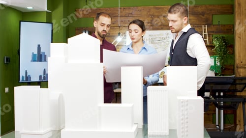 Preview: Chief architect talking with his team about new business park