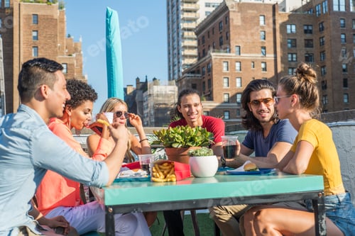 Preview: Group of friends having party on a rooftop