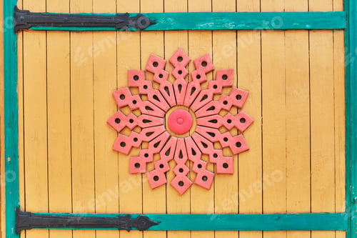Preview: Detail of colored wooden gate with carved pattern. Traditional Tatar ornament. Kazan, Russia