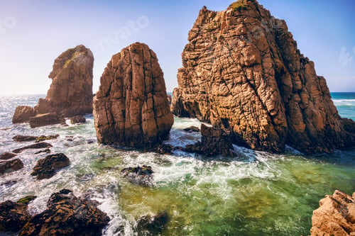 Preview: Ursa beach, Sintra, Portugal. Epic sea stack rocks rising from atlantic ocean in sunset light