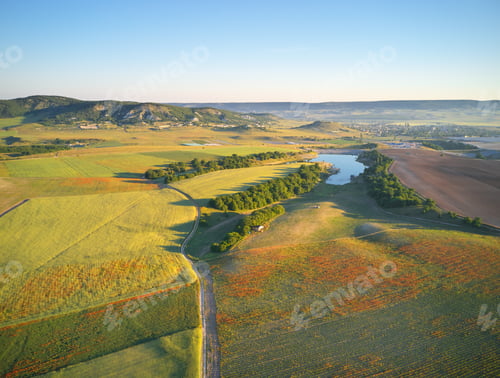 Preview: Aerial fields and meadow in mountain.