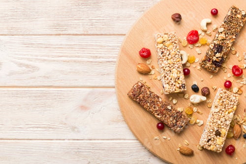 Preview: Various granola bars on table background. Cereal granola bars. Superfood breakfast bars