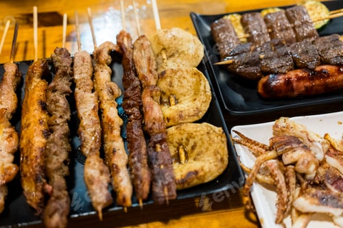 Preview: Variety of meat skewers on dish