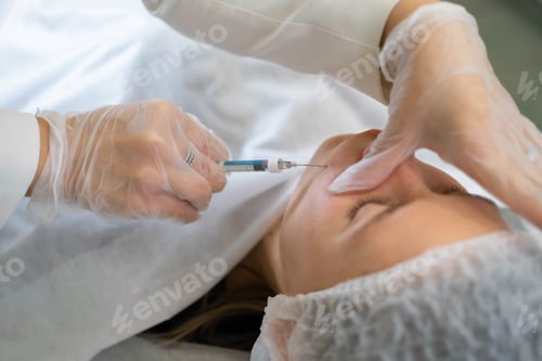 Preview: Cosmetologist administers an injection into the nasolabial fold, targeting signs of aging. Precision