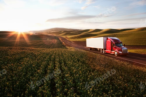Preview: Peterbilt Class8 commercial truck driving through farmlands in eastern Washsington, USA at sunset.