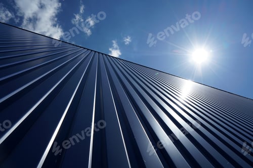 Preview: Low angle shot of a metal wall on a sunny day