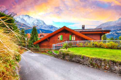 Preview: Fantastic autumn view of traditional swiss chalets in Wengen village
