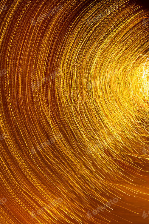 Preview: Long exposure photography, orbiting lines of vibrant neon gold, black background