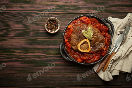Preview: Traditional Italian dish Ossobuco all Milanese made with cut veal shank meat with vegetable tomato
