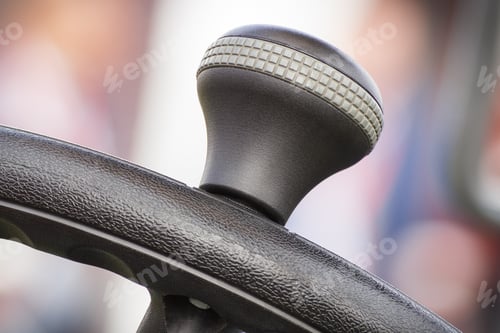 Preview: Closeup of steering wheel in agricultural or industrial machine