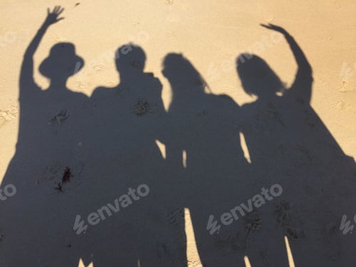 Preview: Shadows of four friends on sand