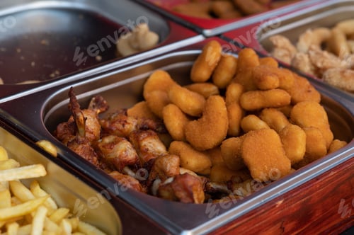 Preview: Fried fish or chicken in batter, at the food market - close-up