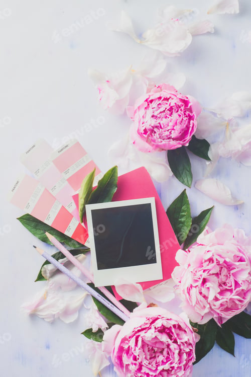 Preview: Minimal styled flat lay with peony flowers, blank photo frame and pink notebook.