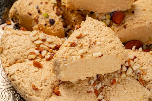 Preview: Close up photo of halva dessert on silver plate