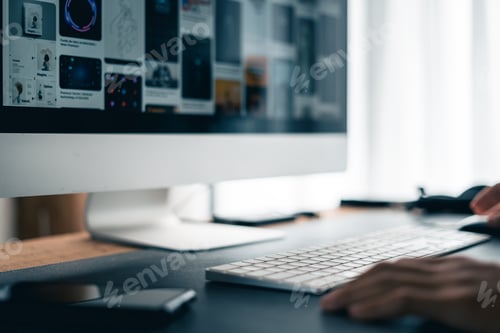 Preview: Man working on computer desk at home office