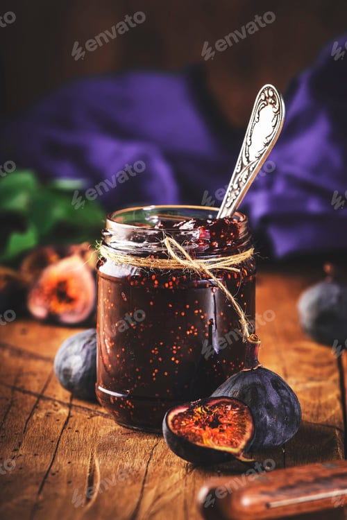 Preview: Fig confiture in glass jar. Fresh fruits on wooden kitchen table, negative space