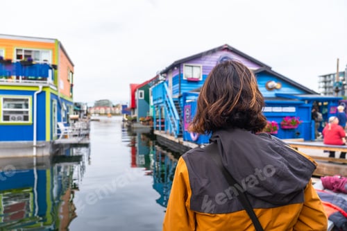 Preview: Tourist admiring fisherman's wharf park in victoria, british columbia