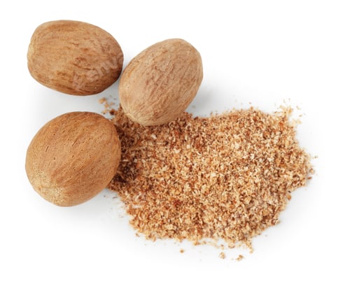 Preview: Whole nutmegs and powder isolated on white, top view