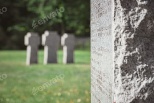 Preview: selective focus of old stone tomb with lettering at cemetery