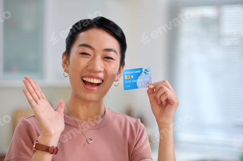 Preview: Excited Woman Showing Credit Card