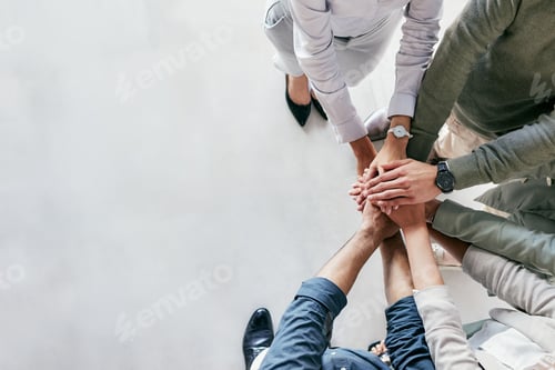 Preview: Shot of a group of unrecognizable businesspeople stacking their hands at work