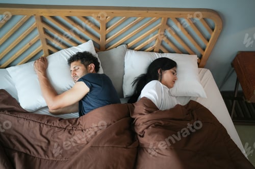 Preview: Loving couple relaxing and sleeping in bed, top view