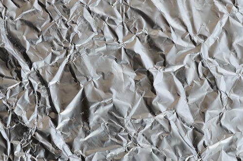 Preview: Thin wrinkled sheet of crushed tin aluminum silver foil background
