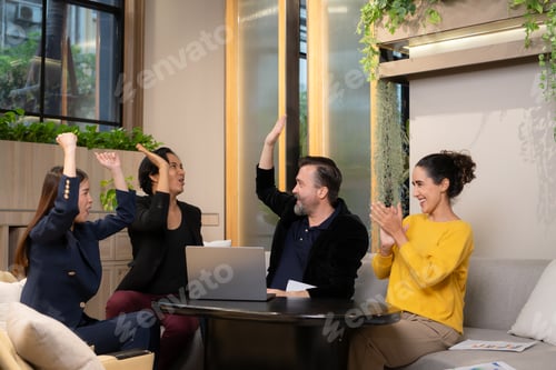 Preview: Businessman and businesswoman discussing a project in the meeting room of co-working space