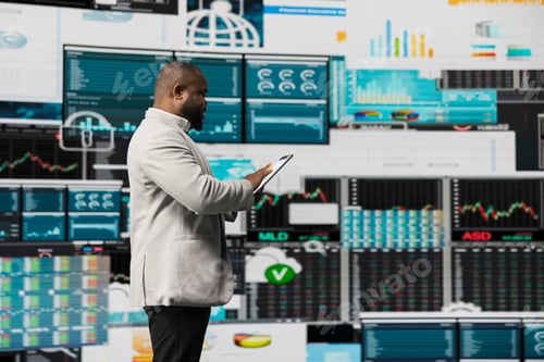 Preview: African american guy reflecting on annual financial reports for new development