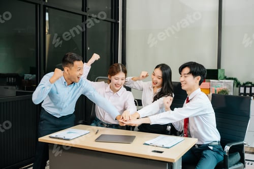 Preview: Happy businesspeople while collaborating on a new project in an office.