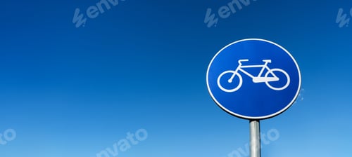 Preview: Blue Bicycle Lane Sign against Clear Sky