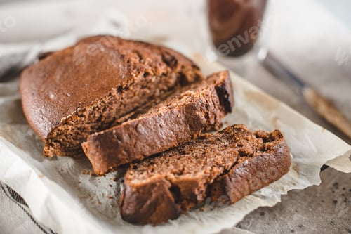 Preview: Banana bread sliced with coffee. Vegan pasrty. Home bakery concept. Close-up