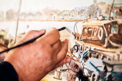 Vorschau: Nahaufnahme eines Künstlers, der in seinem Atelier Öle malt.