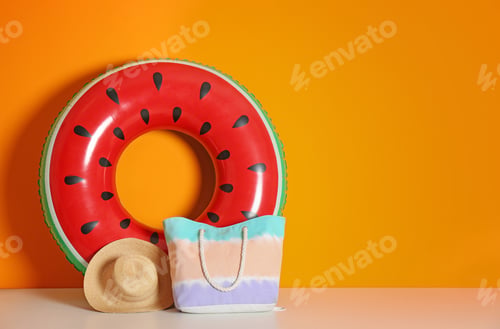 Preview: Beach objects near color wall with space for design. Summer vacation