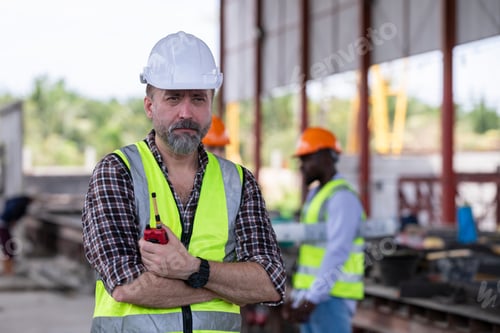 Preview: Engineer or worker architecture wearing safety uniform survey and working at structure building site