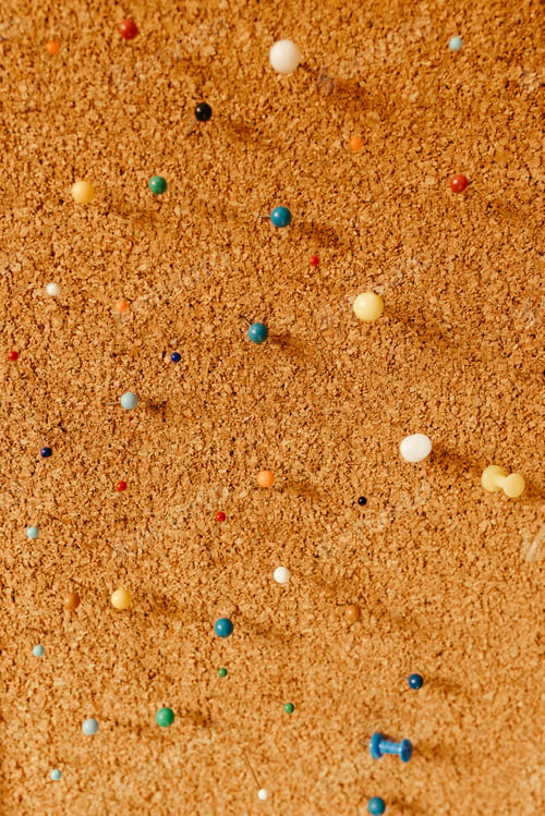 Preview: A vertical shot of different colored pins