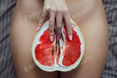 Preview: Sex and female masturbation. A lies on a bed between Pamela's legs. Grapefruit symbolizes the female