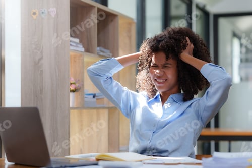 Preview: Young business woman worried about problem at work and stressed about problem with laptop computer.