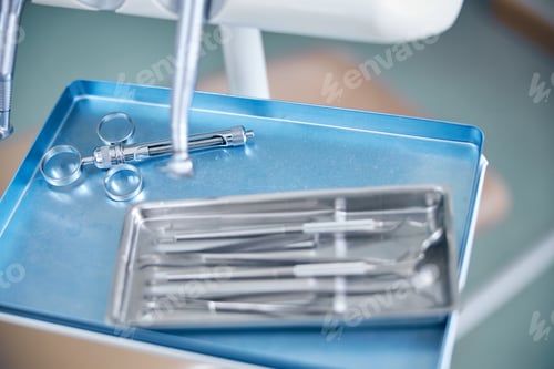 Preview: Set of dental instruments on metal tray