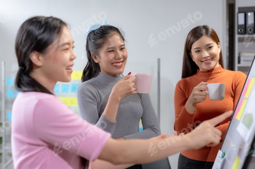 Preview: Team of young Asian businesswomen plan and meeting together and present marketing idea