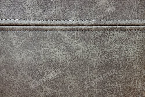Preview: Texture gray leather with a horizontal decorative seam, closeup background