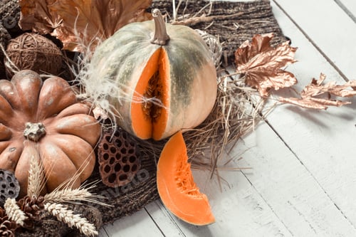 Preview: Autumn background with decorative items and pumpkin.