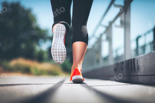 Preview: City workout. Woman running in an urban setting