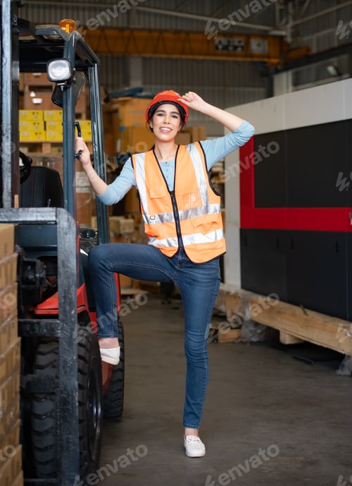 Preview: Portrait of an Asian woman with a forklift used to lift heavy objects in a warehouse.