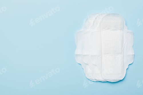 Preview: Women hygiene products or sanitary pad on colored background.