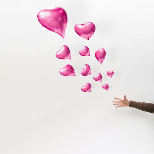 Preview: Heart shaped balloons floating away. Minimal love concept.