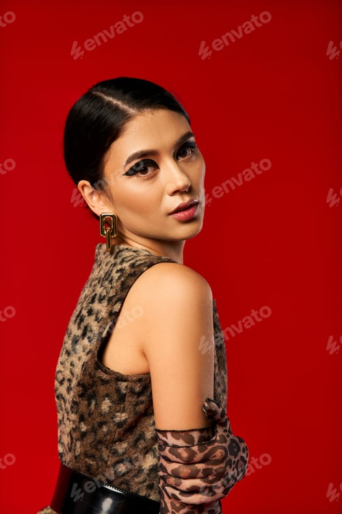 Preview: Fashionable Woman in Leopard Print Against Red Background