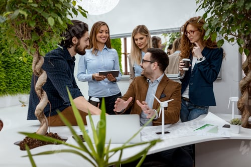 Preview: Team Discussing Green Energy in Modern Office