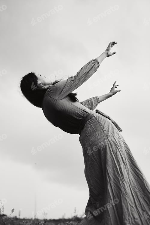 Preview: pretty woman in dress dramatic style emotions posing black and white photo